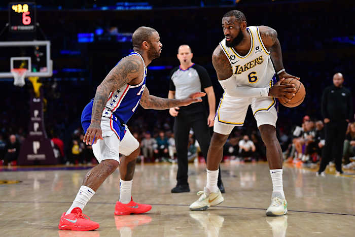 76ers forward P.J. Tucker defends Lakers forward LeBron James.